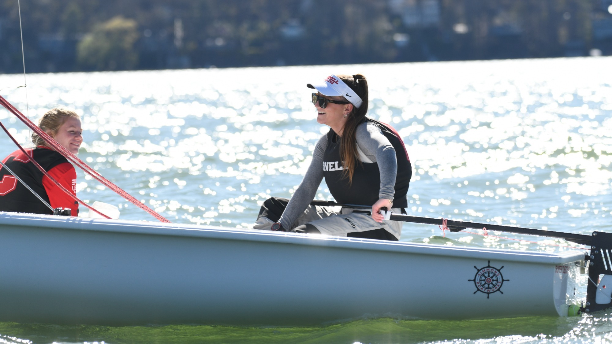 Bridget Green and Sophia Mulvania skipper and crew a boat at practice.