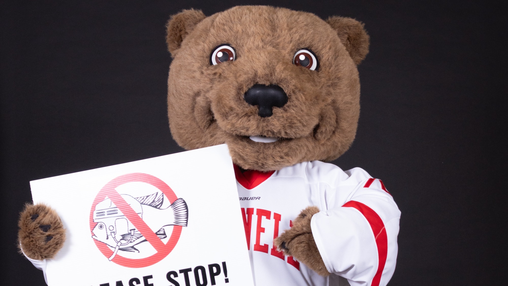 Touchdown the Bear poses with a No-Fish sign during a media day shoot during the 2023-24 academic year.