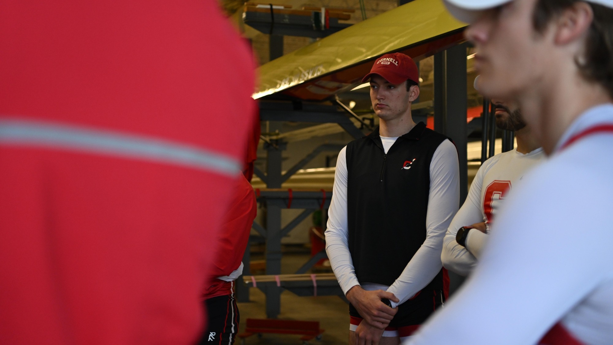 Cornell men's heavyweight rower Finn Hayes goes over a game plan during a pre-race meeting before competing against Harvard on April 5, 2025, at the Cornell Rowing Center in Ithaca, N.Y.