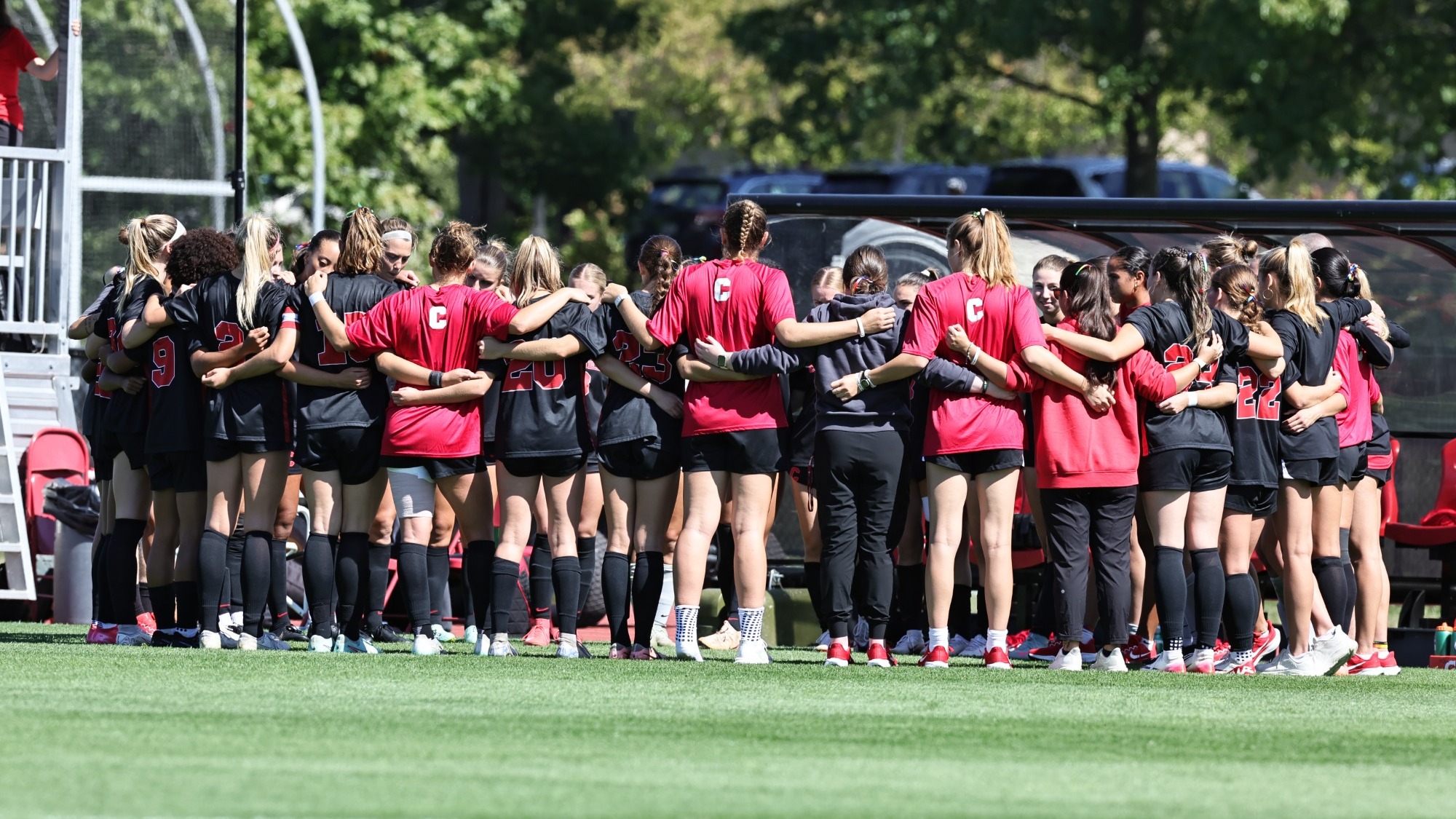 Members of the Cornell women's soccer team huddle before a match against Columbia on Sept. 20, 2025, on Berman Field in Ithaca, N.Y.