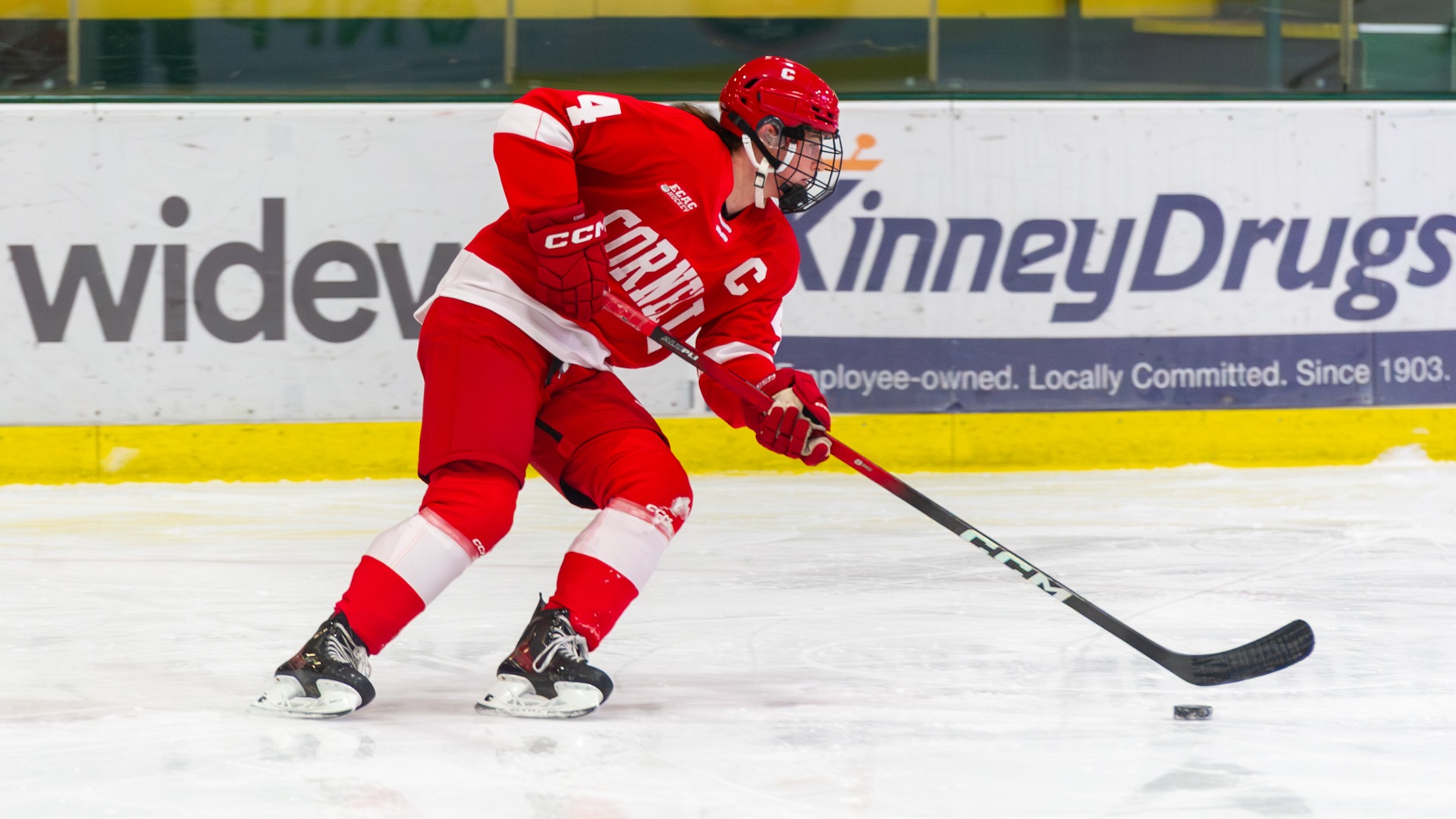 Grace Dwyer handles the puck while in action against the Vermont Catamounts.