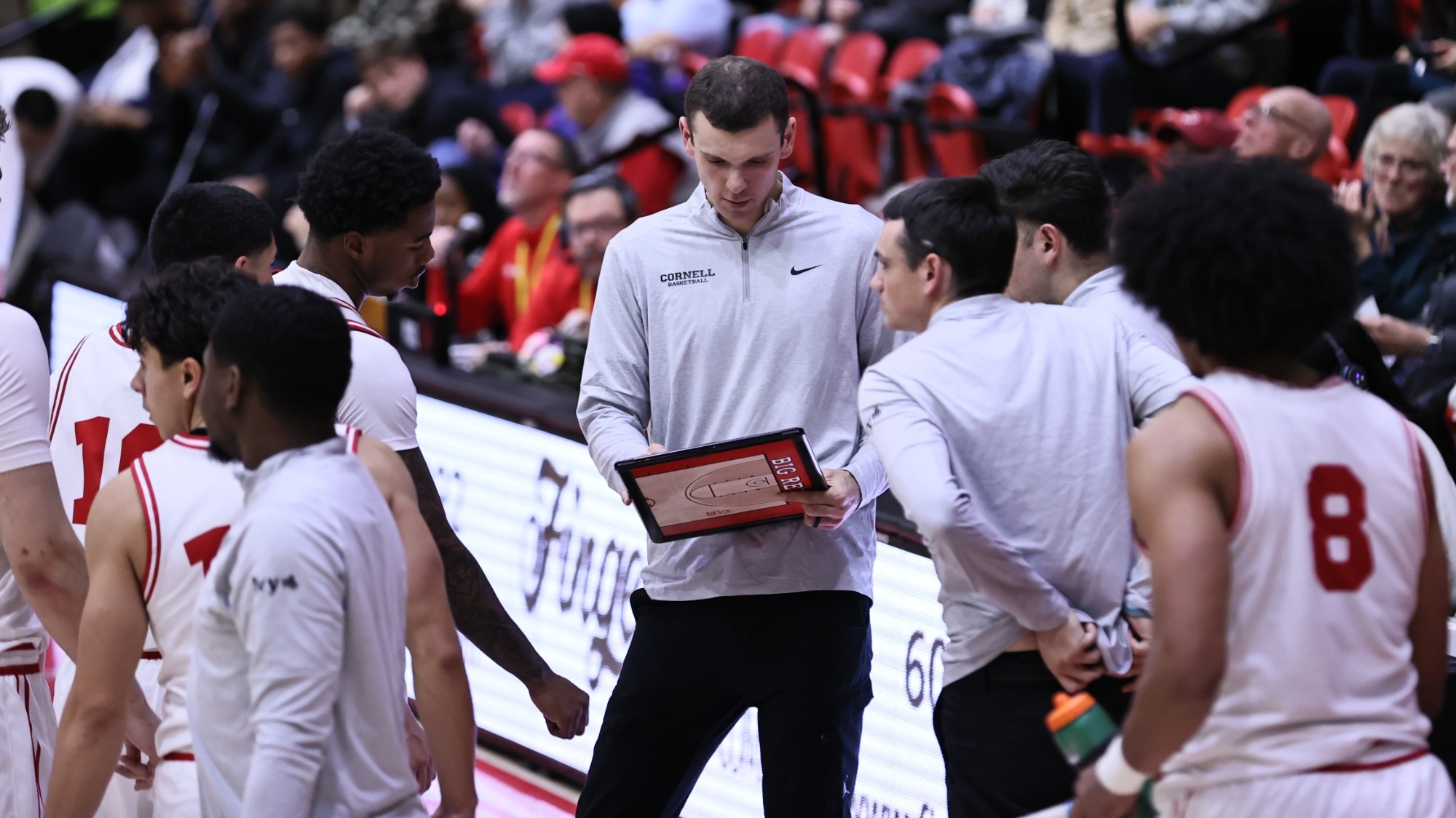 The Cornell men's basketball team huddles during a timeout during the Big Red's win over Army West Point at Newman Arena in Ithaca, N.Y. during the 2025-26 season.