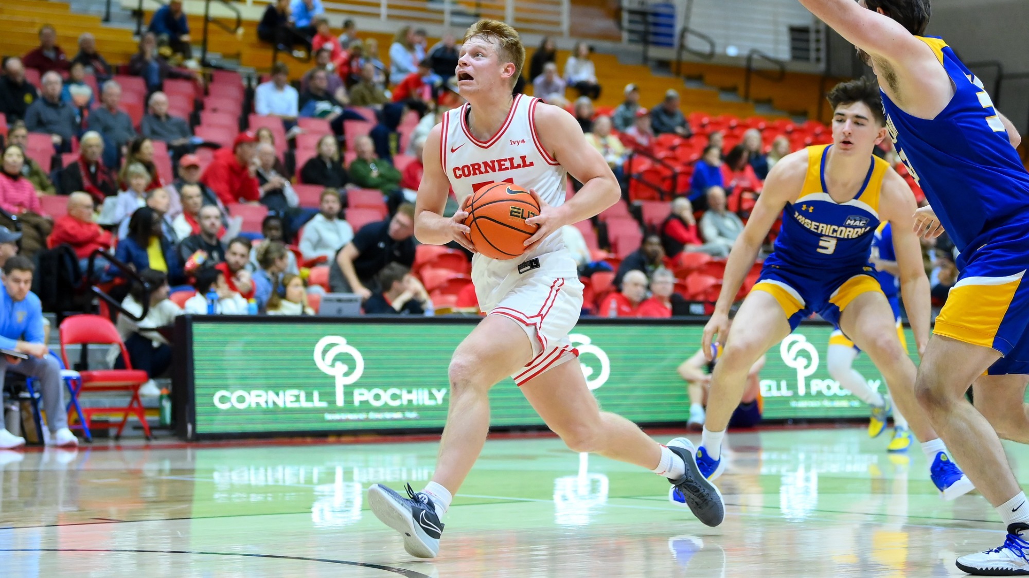 Cooper Noard drives to the basket during Cornell's 114-70 victory over Misericordia at Newman Arena in Ithaca, N.Y.