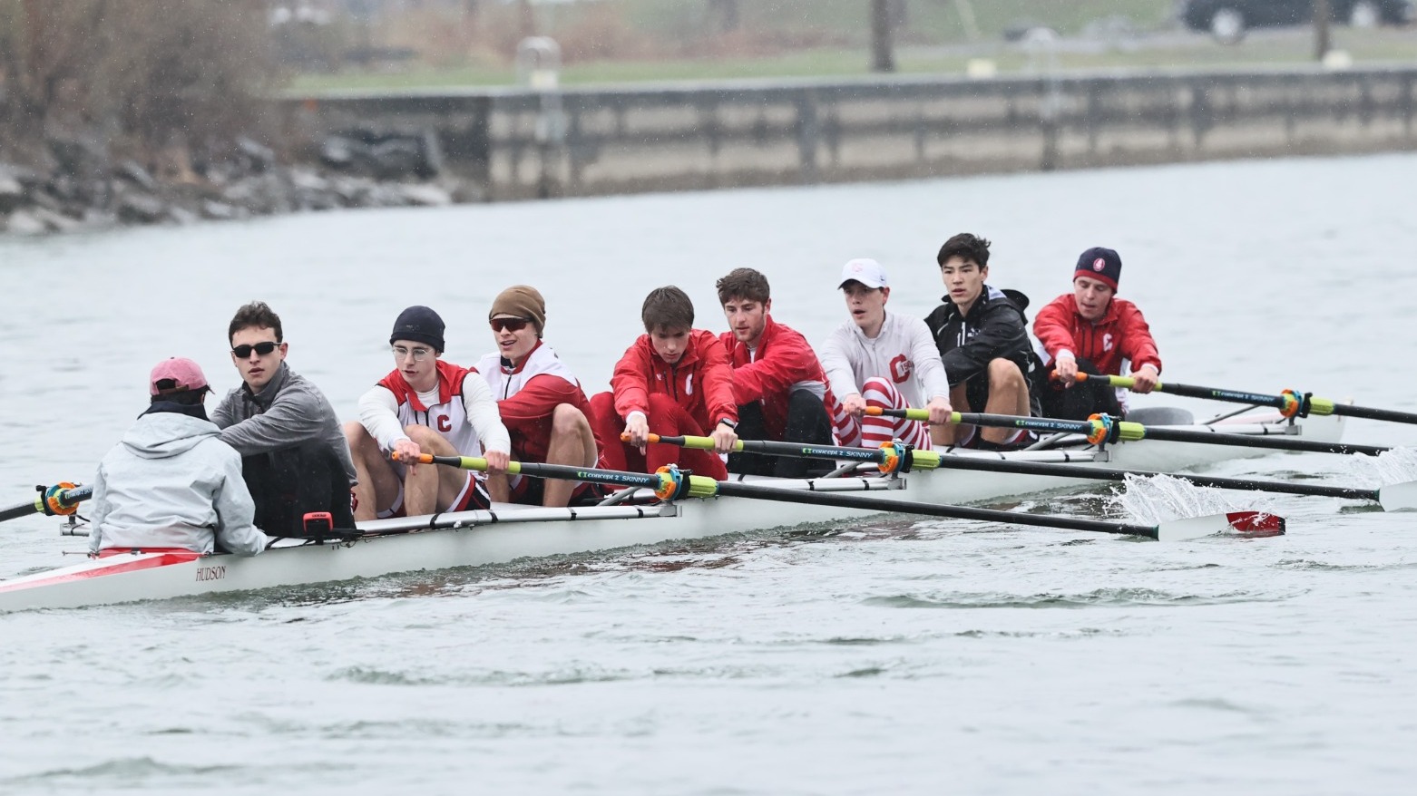 Members of the Cornell men's lightweight rowing 1V8 crew compete against Princeton on April 12, 2025, on the Cayuga Inlet in Ithaca, N.Y.