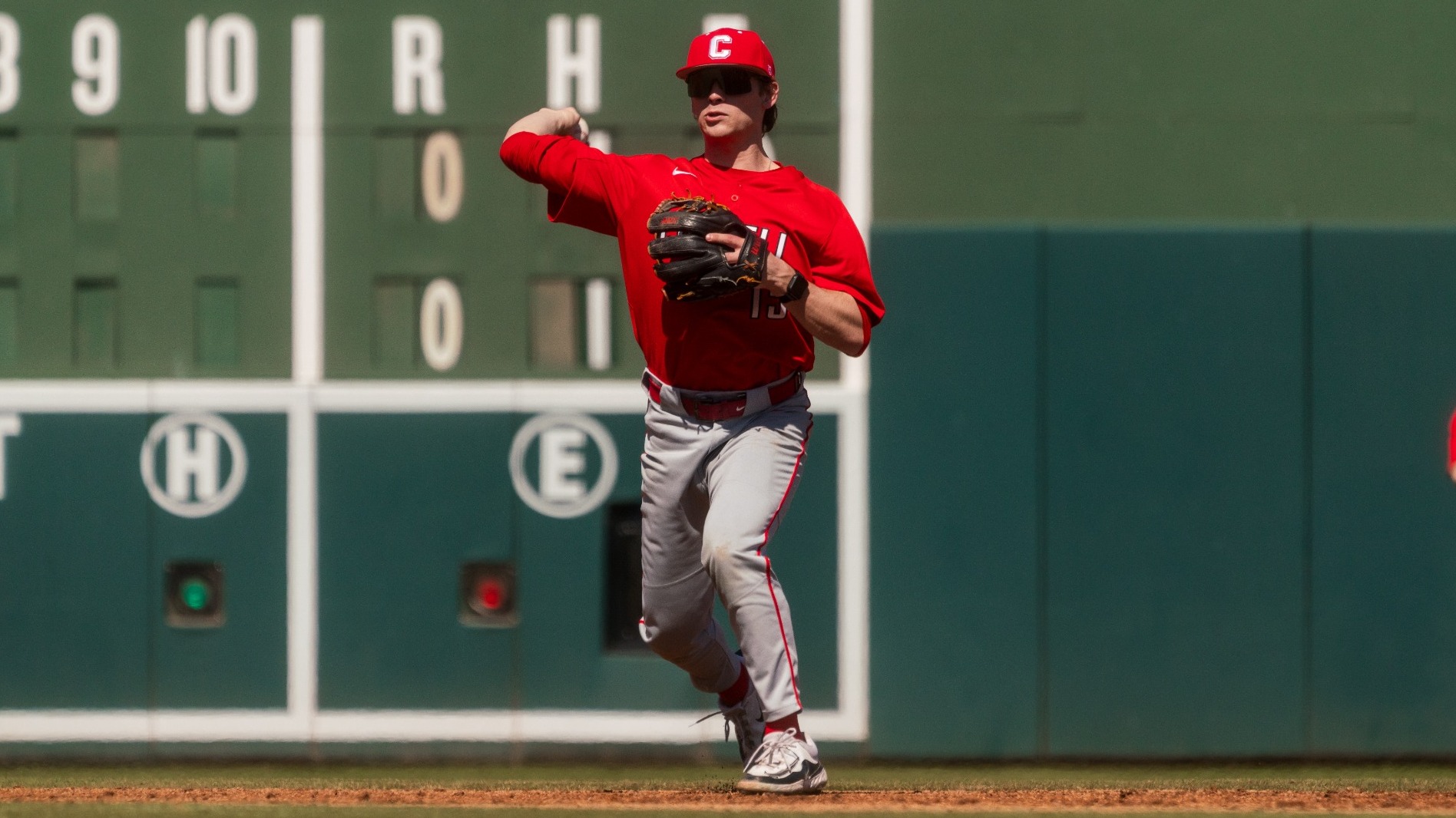 Cornell baseball second baseman Owen Carlson goes to throw a baseball to first base during game action against UAB at Fluor Field in Greenville, S.C., on March 8, 2025.
