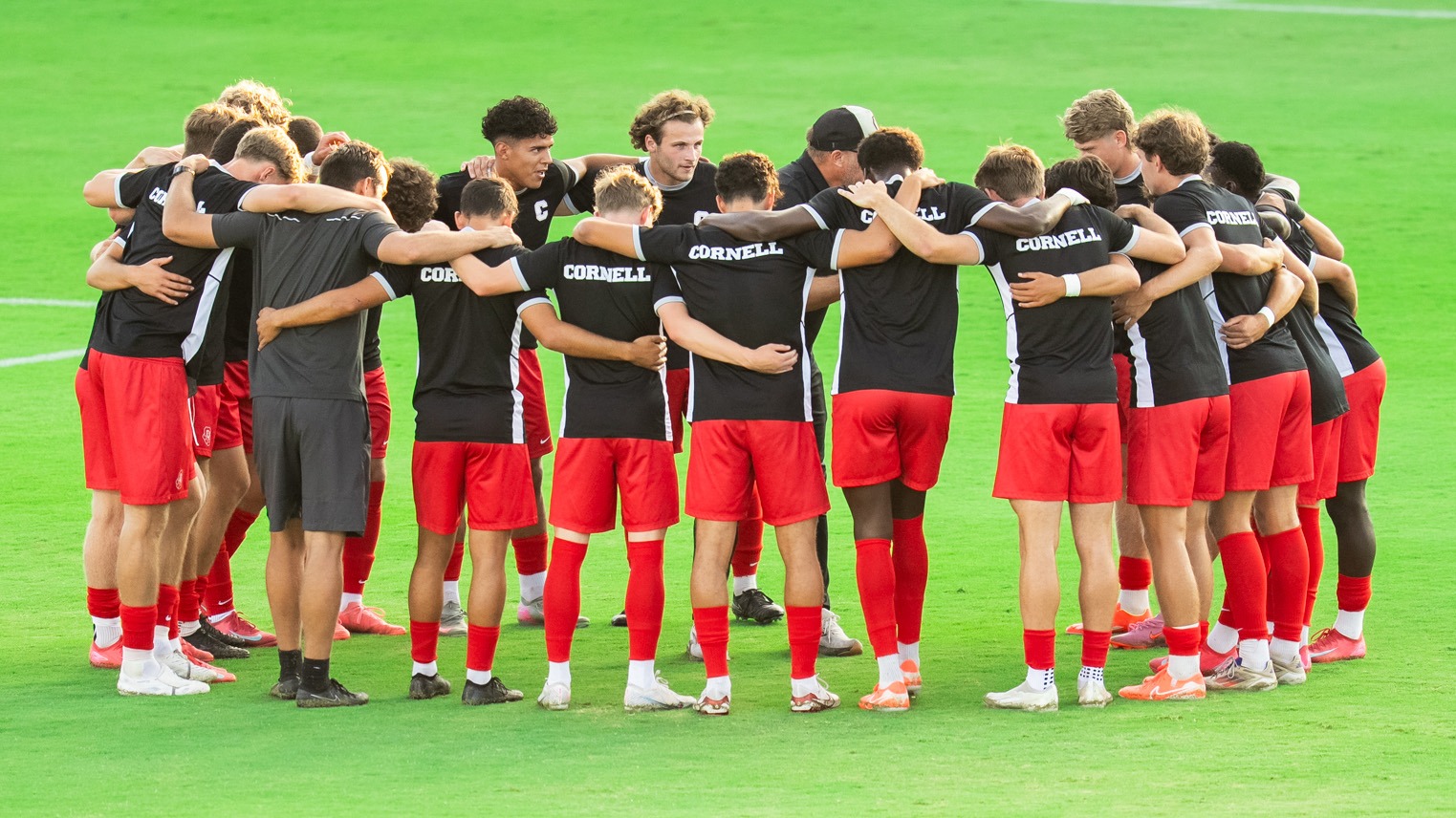 Cornell men's soccer huddles up prior to a game against UC Santa Barbara at Harder Stadium.