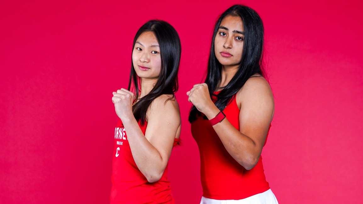 Cornell women's squash players Xin Ying Yee and Aishwarya Khubchandani pose for media day photos before the 2025-26 season.