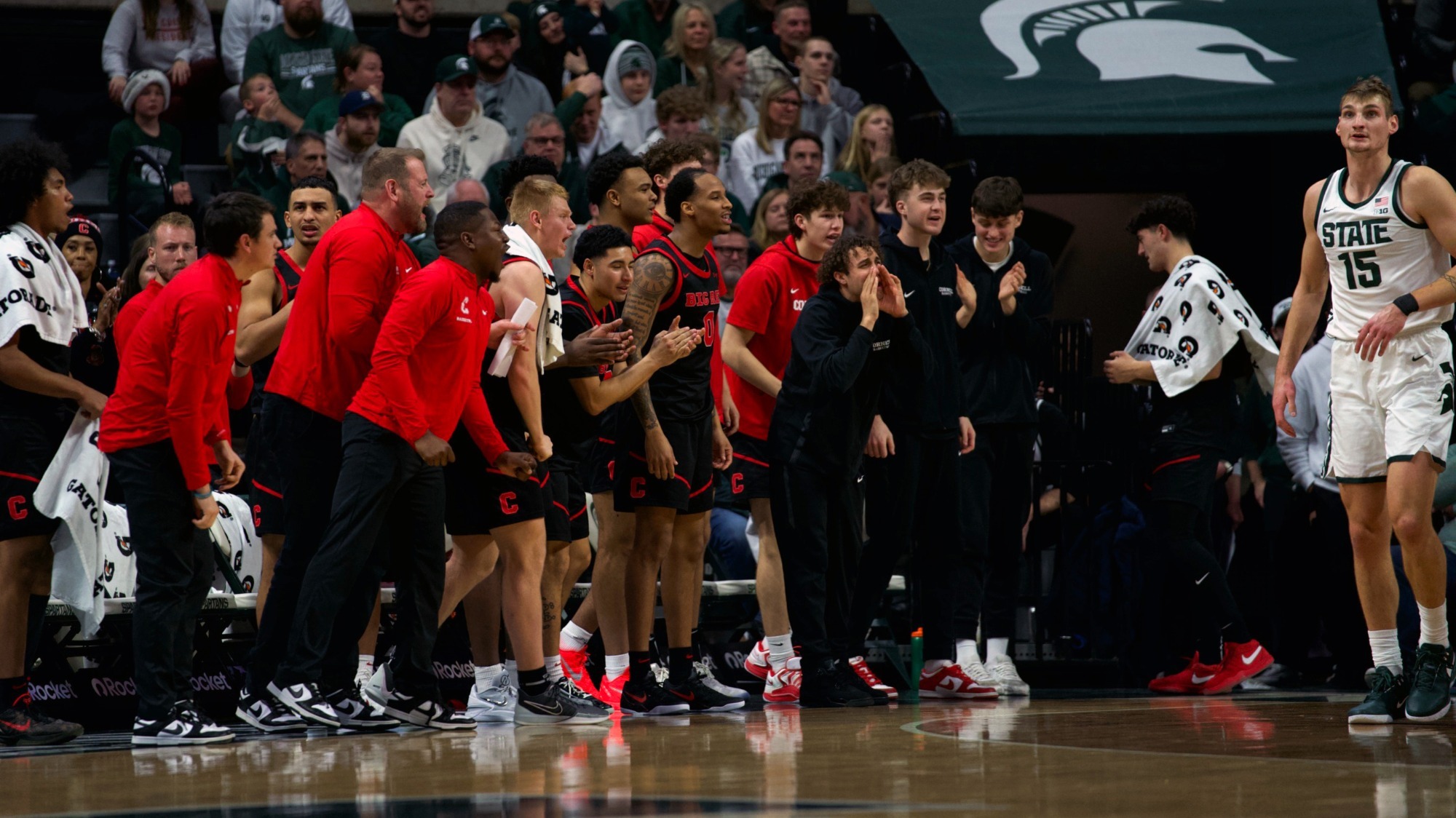 The Cornell men's basketball team celebrates from the bench during a game at Michigan State on Dec. 29, 2025 in East Lansing, Mich.