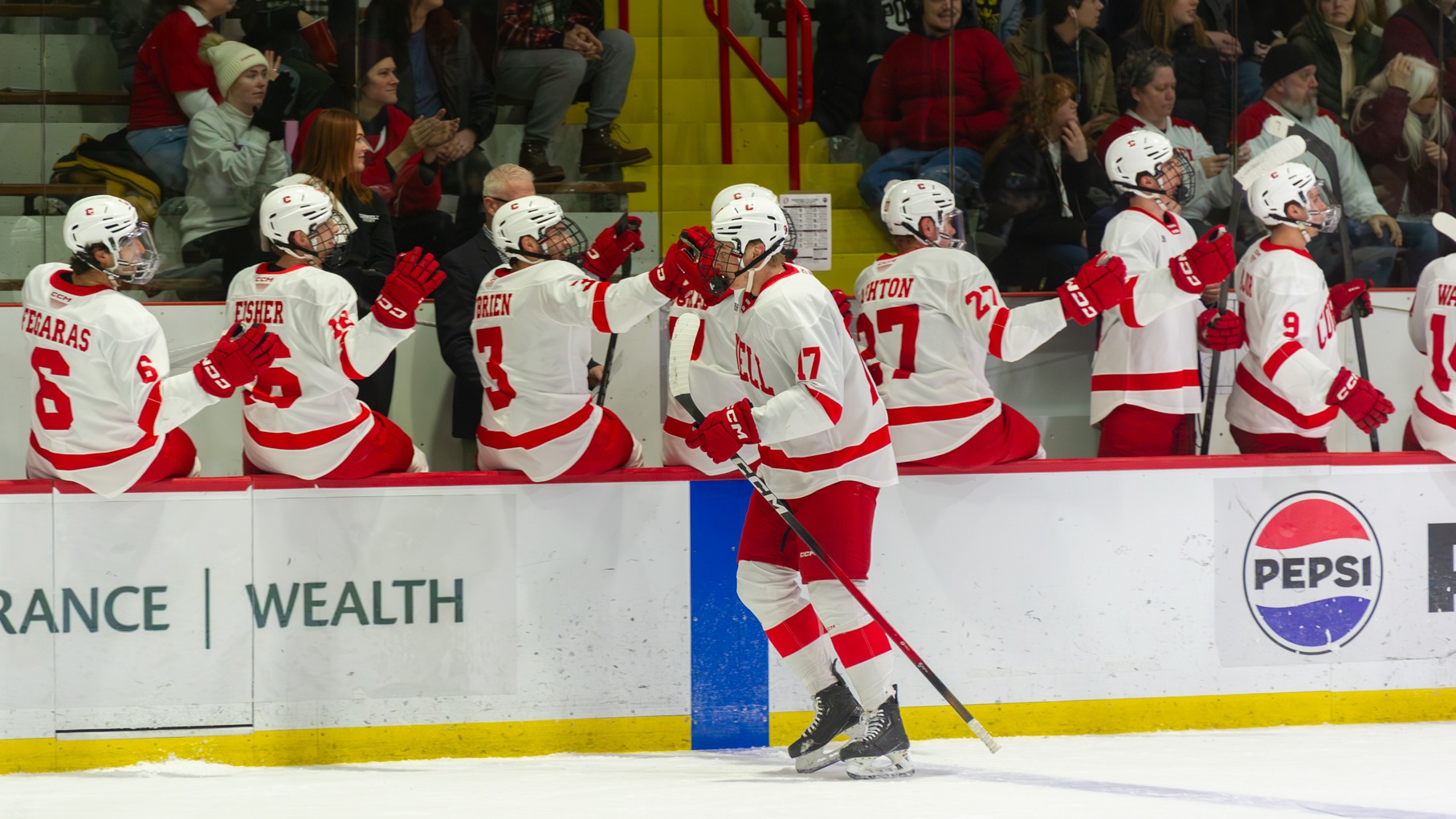 Cornell men's hockey freshman forward Aiden Long high-fives teammates on the bench after scoring against Omaha at Lynah Rink in Ithaca, N.Y., on Jan. 3, 2026.