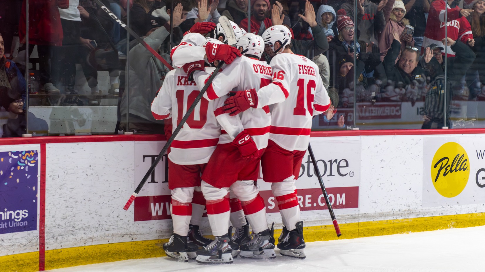 Members of the Cornell men's hockey team celebrate after scoring a goal against Omaha during the 2025-26 season.