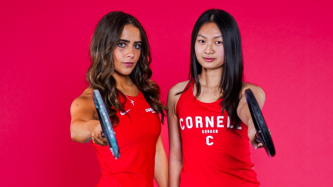 Cornell women's squash players Christa Kay and Xin Ying Yee pose for media day photos before the 2025-26 season.