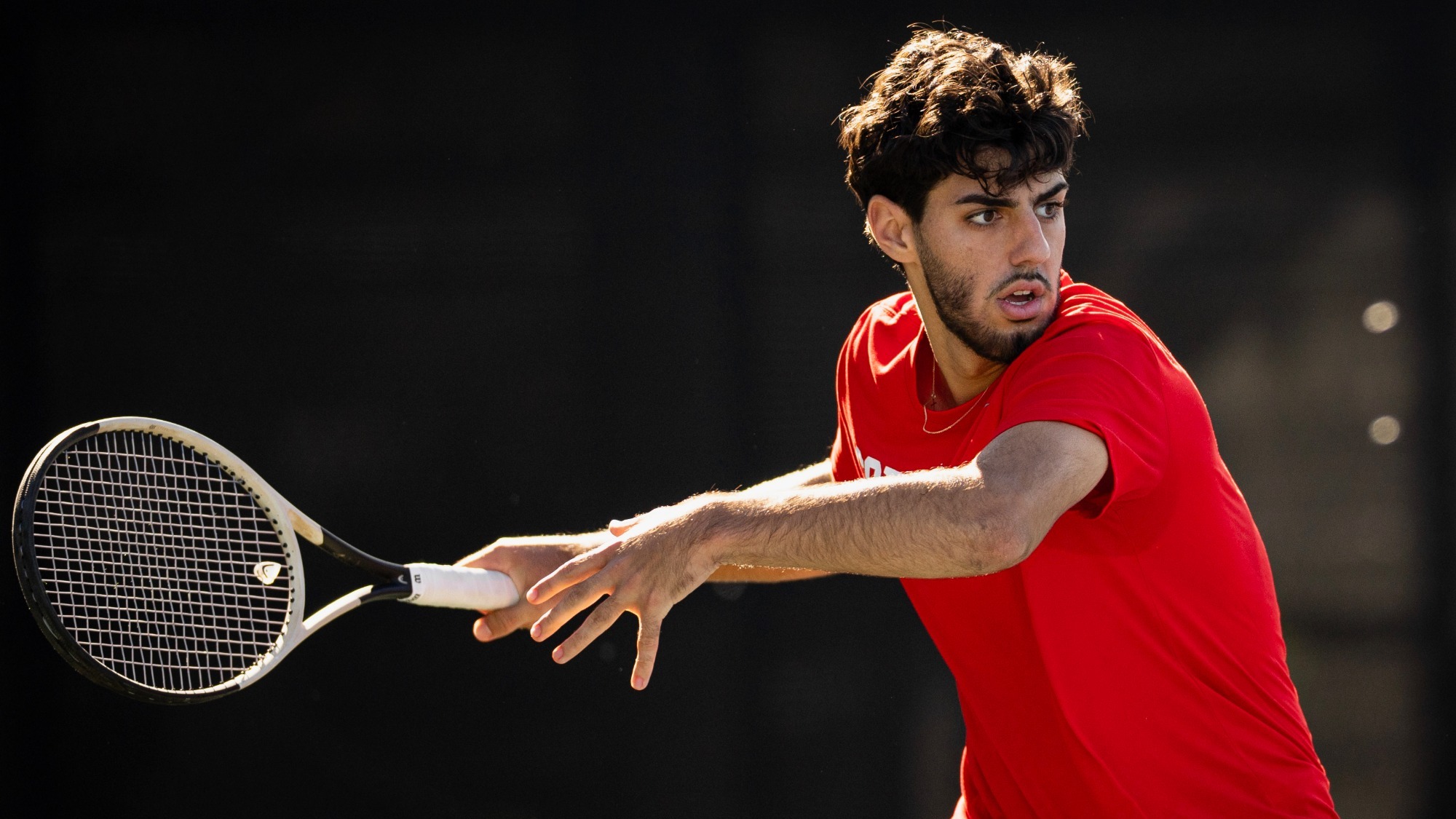 Cornell men's tennis freshman Cezar Papoe goes to hit a return during match action at the ITA New England Regionals, hosted by Harvard at Cambridge, Mass., on Oct. 9, 2026.