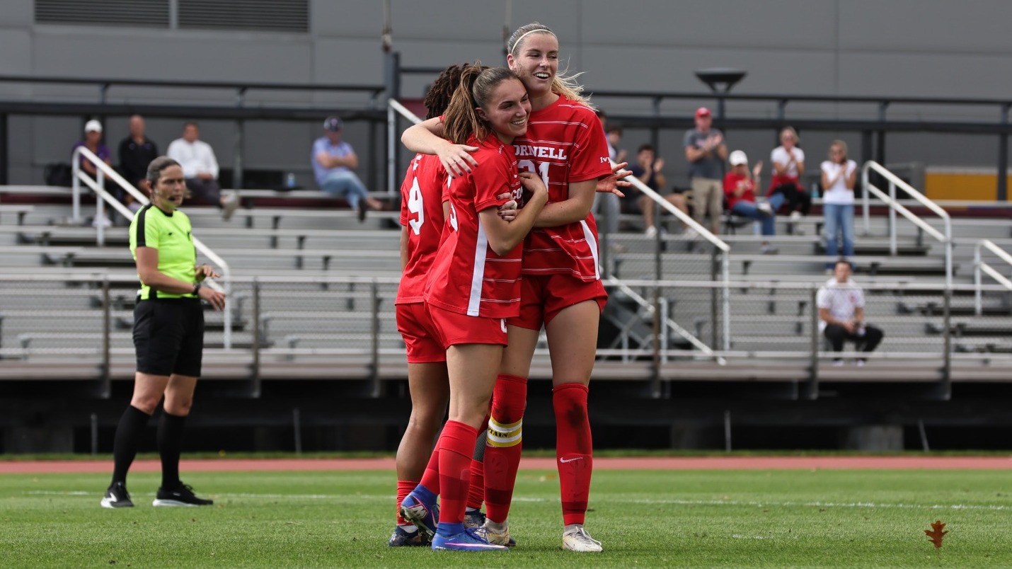 Cornell women's soccer sophomore forward Jessica Alessi and senior midfielder Emily Gibbons hug after scoring a goal against Holy Cross on Oct. 13, 2026, at Berman Field in Ithaca, N.Y.