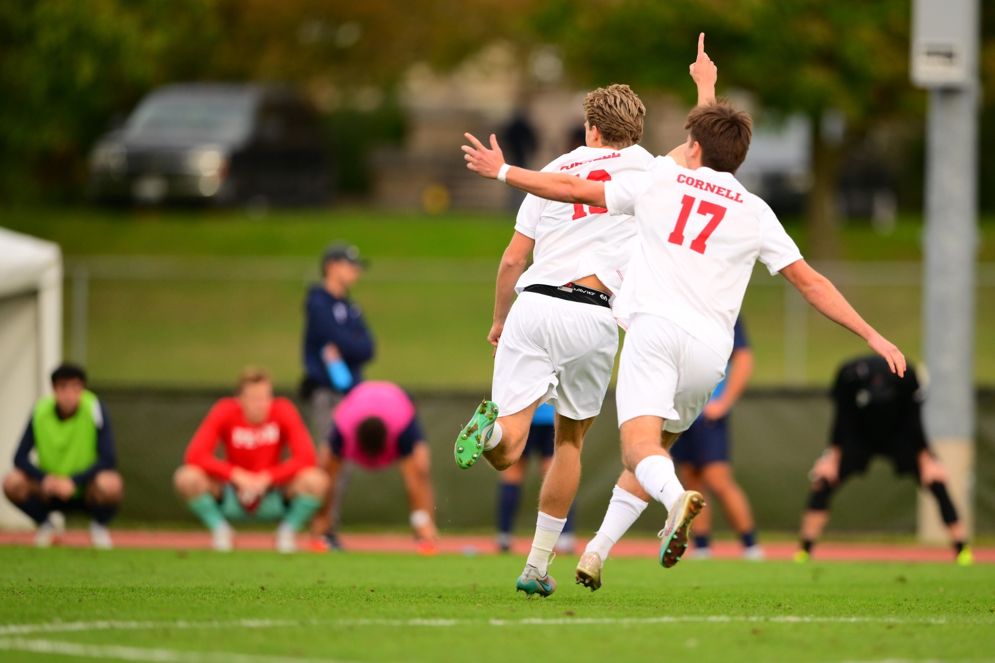 Kasper Wollstein and Nate Hovan celebrate a goal vs Penn