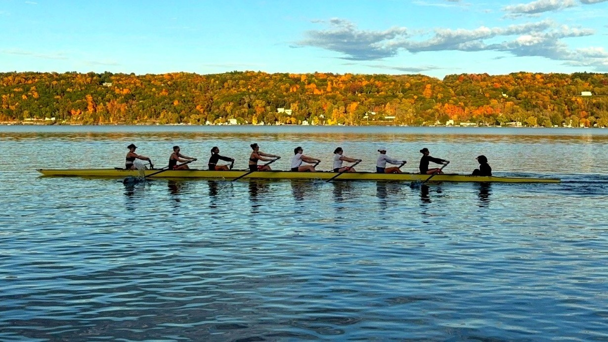 A wide angle of the Cornell women's rowing team practicing on Cayuga Lake during the 2026-27 season.