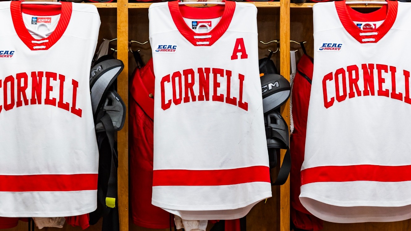 A close-up photo of Cornell men's hockey sweaters hanging inside the locker room at the 1980 Rink — Herb Brooks Arena in Lake Placid, N.Y., on March 20, 2026.