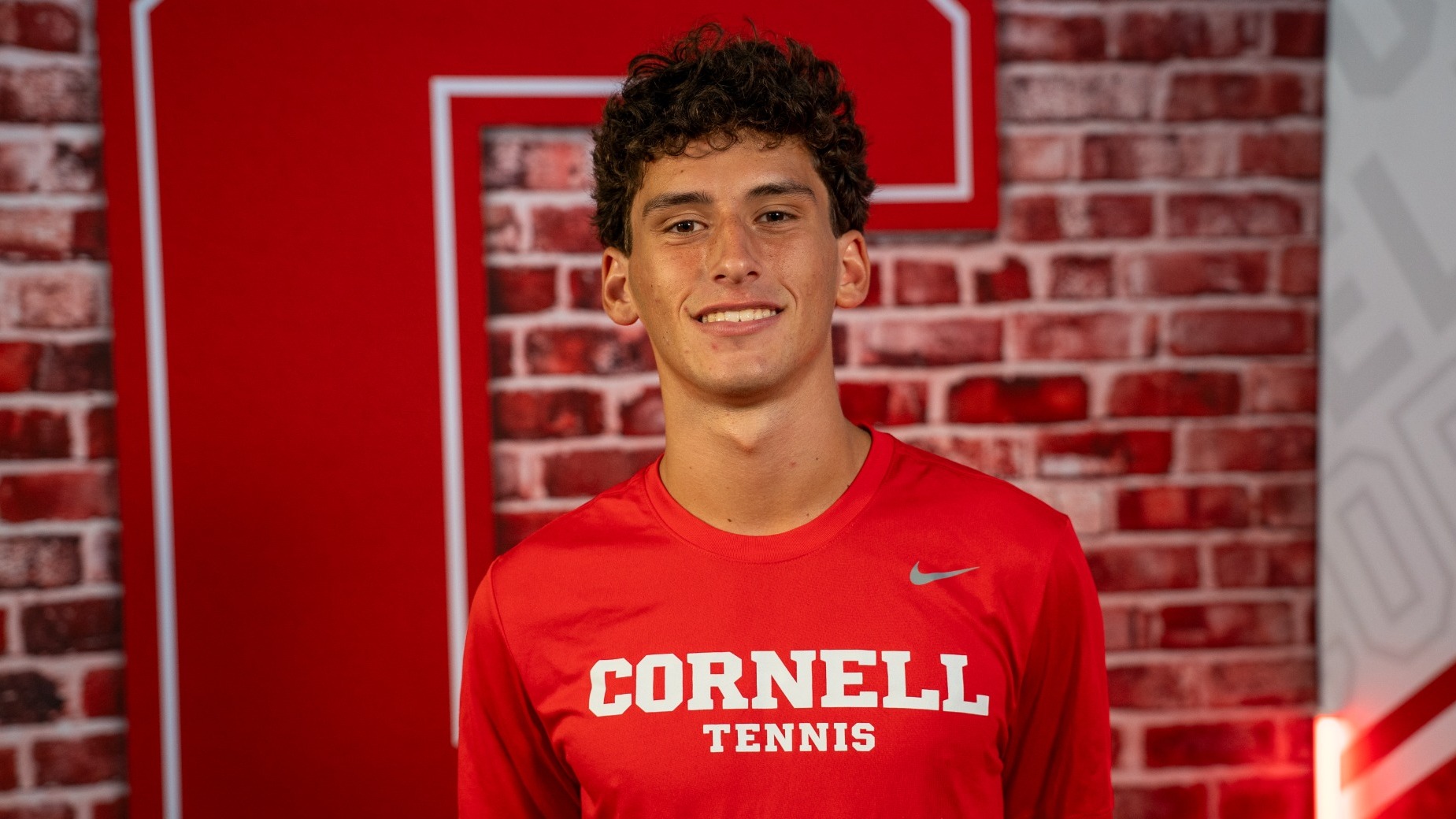 Cornell men's tennis freshman Greg Bernadsky poses for a media day photo inside Barton Hall in Ithaca, N.Y., on Sept. 10, 2026.