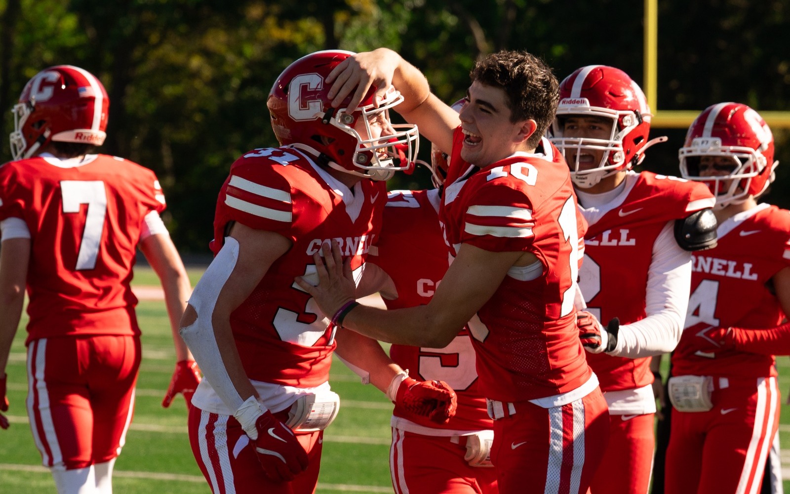 Kyle Melkonian and Jason Milo celebrate on the sidelines
