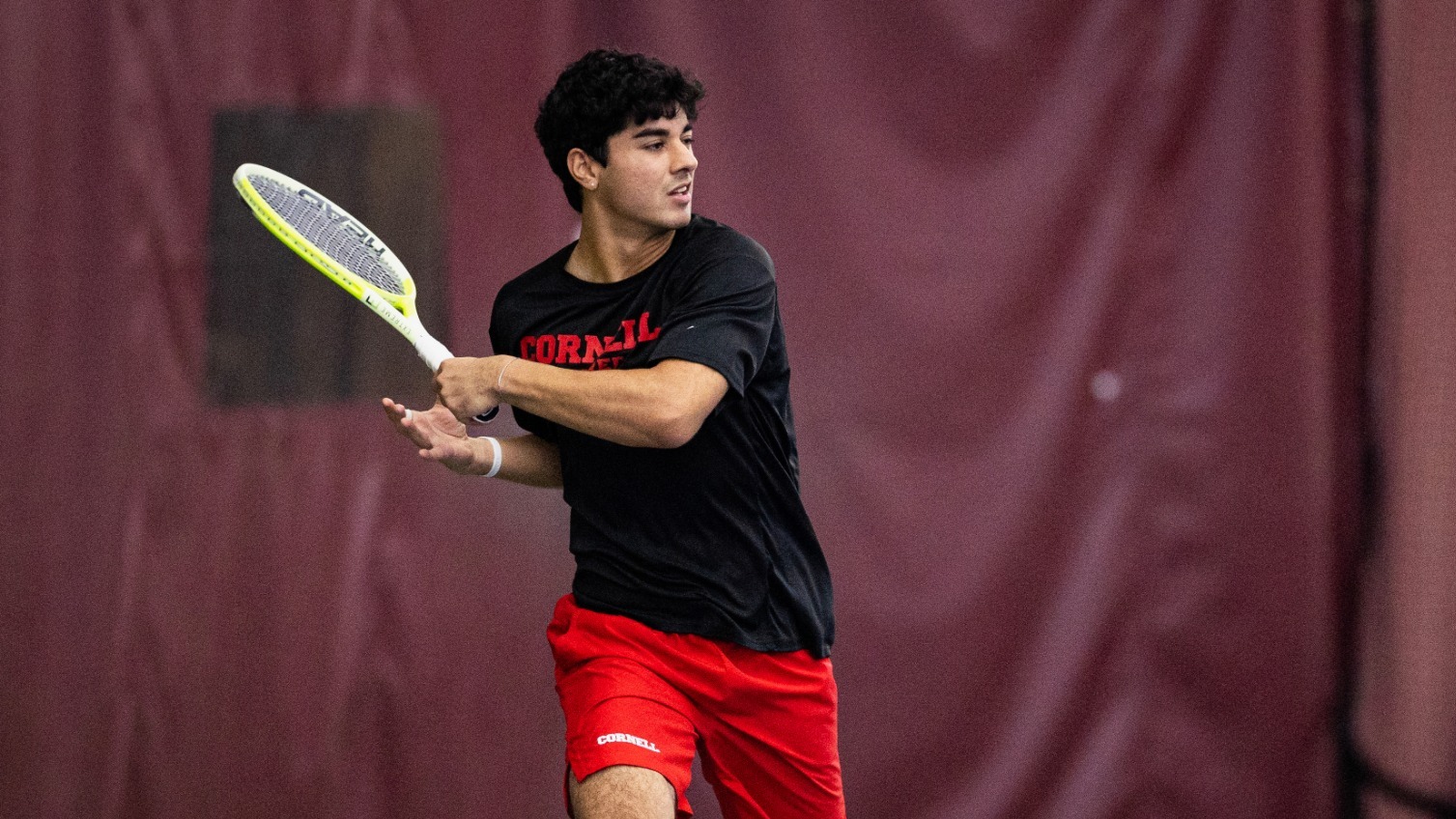 Cornell men's tennis junior Rushil Khosla follows through a shot during match action at the 2026 ITA New England Regional at Harvard University in Cambridge, Mass., on Oct. 9, 2026.