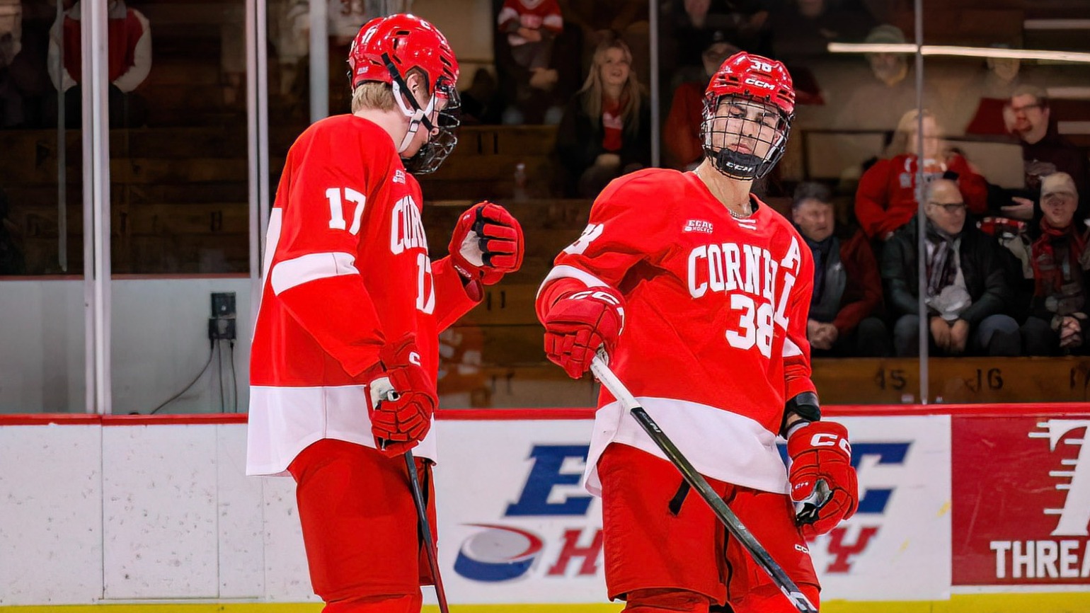 Aiden Long goes to fist bump Jonathan Castagna in pregame introductions before the Cornell men's hockey team's game at St. Lawrence on Dec. 6, 2025, at Appleton Arena in Canton, N.Y.
