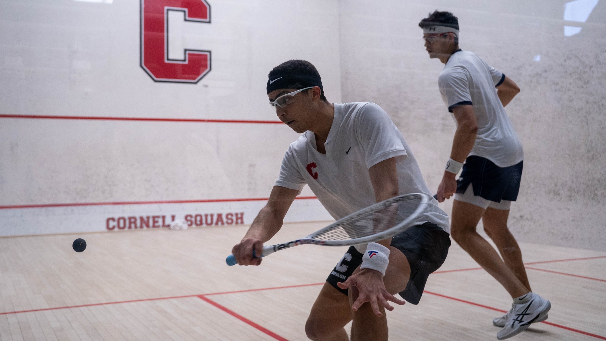Cornell freshman men's squash player Aly Ezzat goes to hit a squash ball during match action against Yale on Feb. 14, 2026, at the Belkin Squash Courts in Ithaca, N.Y.