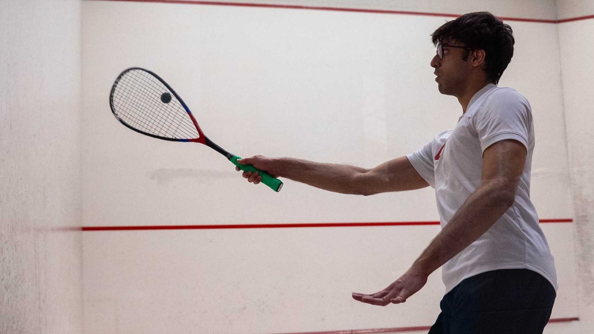 Cornell sophomore men's squash player Vivaan Shah goes to hit a squash ball during match action against Yale at the Belkin Squash Courts on Feb. 14, 2026.