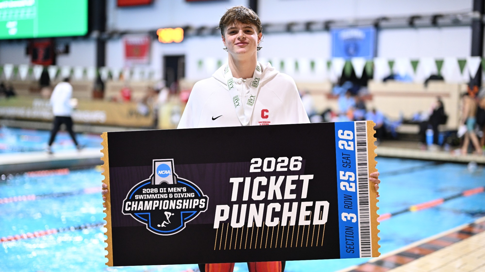 Conway poses with the NCAA Ticket Punched sign after winning an Ivy League Championship