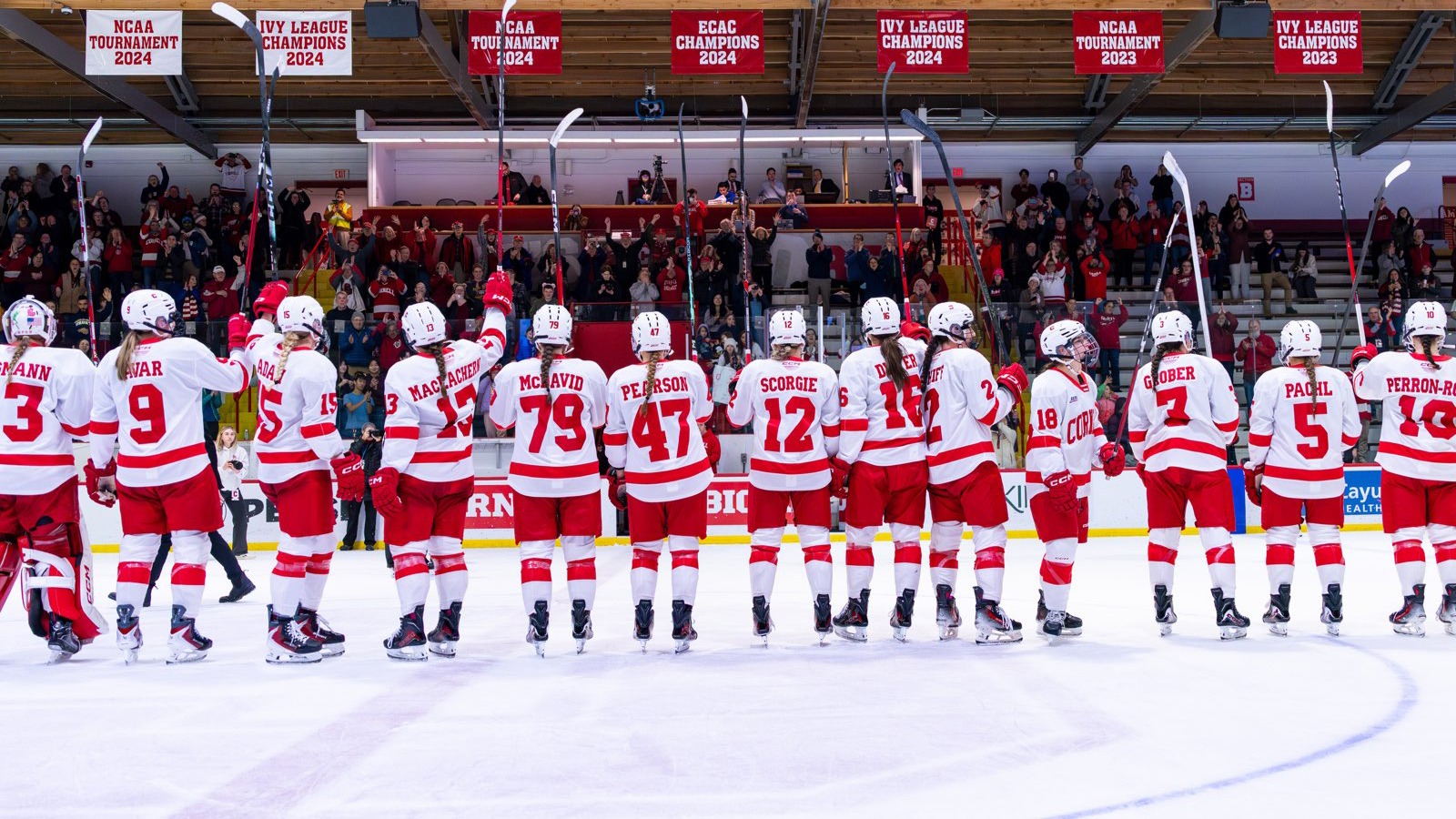 Women's ice hockey address the fans after a victory against Colgate at Lynah Rink.