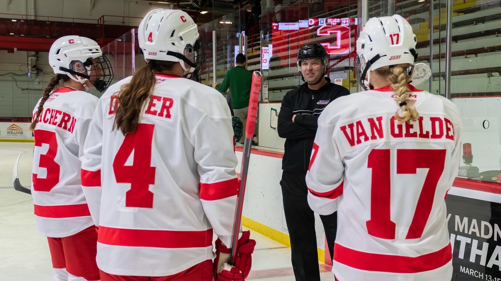 Women's ice hockey captains meet the the officials at Lynah Rink.