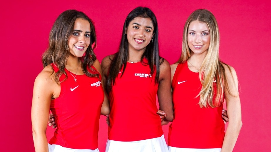 Cornell women's squash players Christa Kay, Saniya Jaggi and Maya Voloshin pose for a media day photo before the 2025-26 season