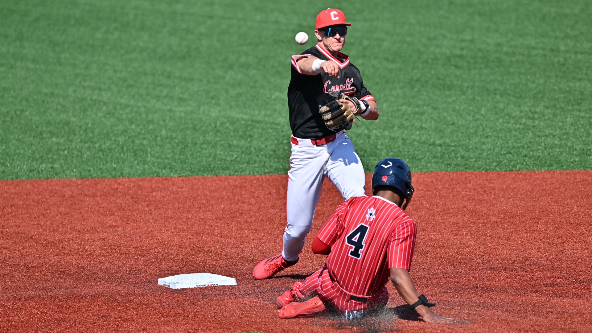 Cornell baseball infielder Luke Johnson goes to throw to first base during game action at Richmond at Pitt Field in Richmond, Va., on March 1, 2026.
