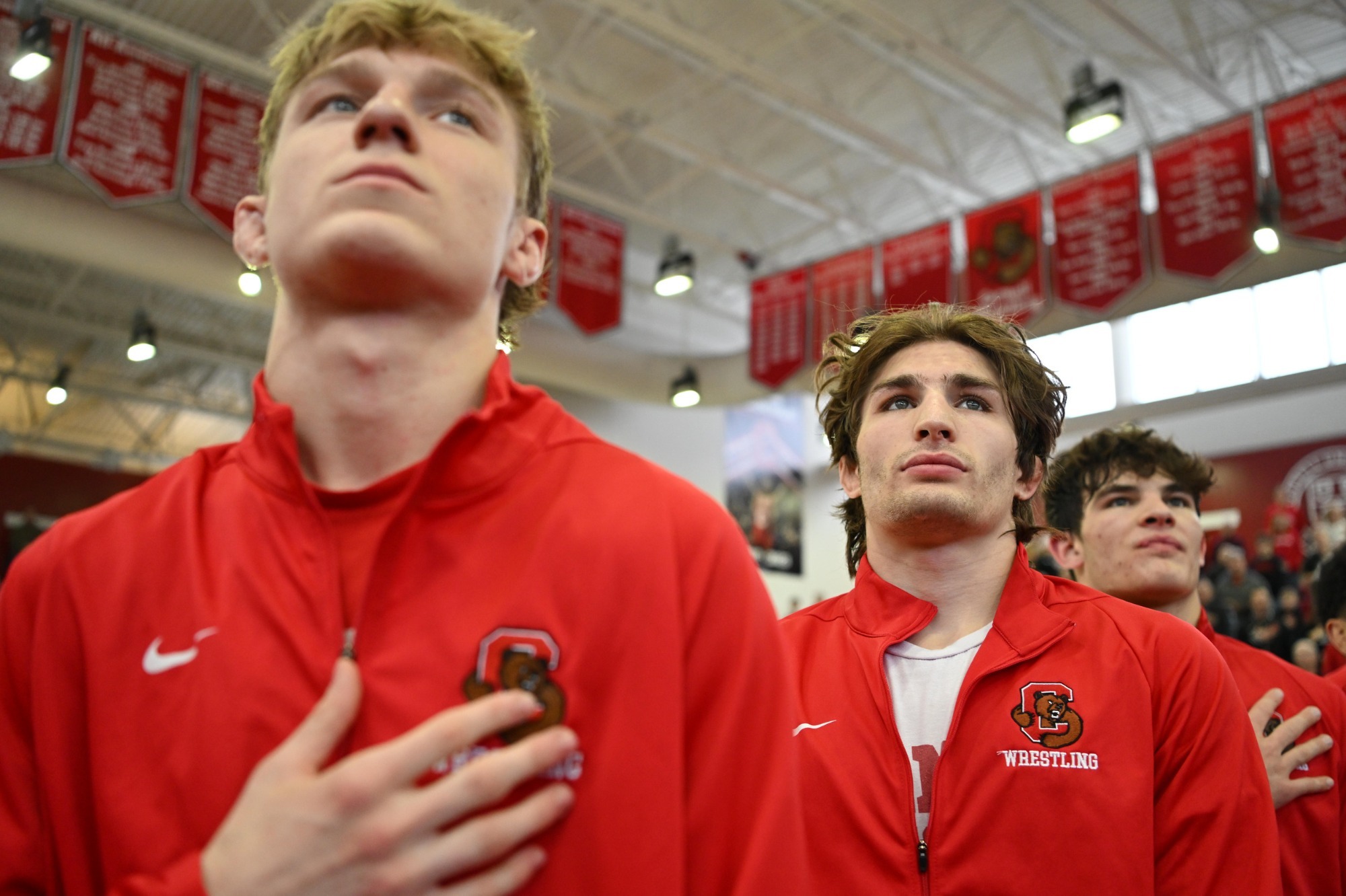 Cornell Wrestling standing for national anthem before facing columbia at home