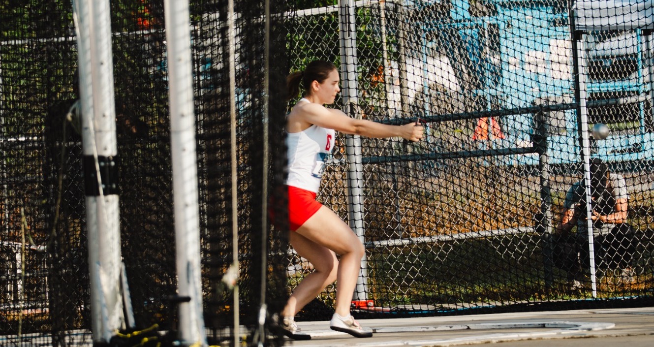 Avery Hastings competing in outdoor weight throw