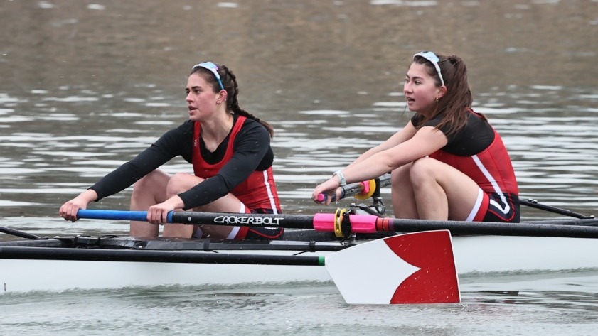 Zoe Benitez and Isabella Capelli row during race action during the 2024-25 season.