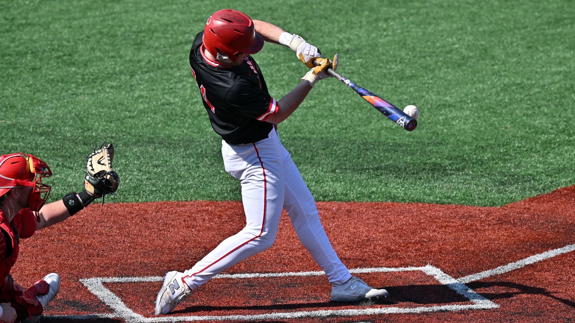 Cornell baseball junior shortstop Kevin Hager connects with a baseball during game action against Richmond on March 1, 2026, at Pitt Field in Richmond, Va.