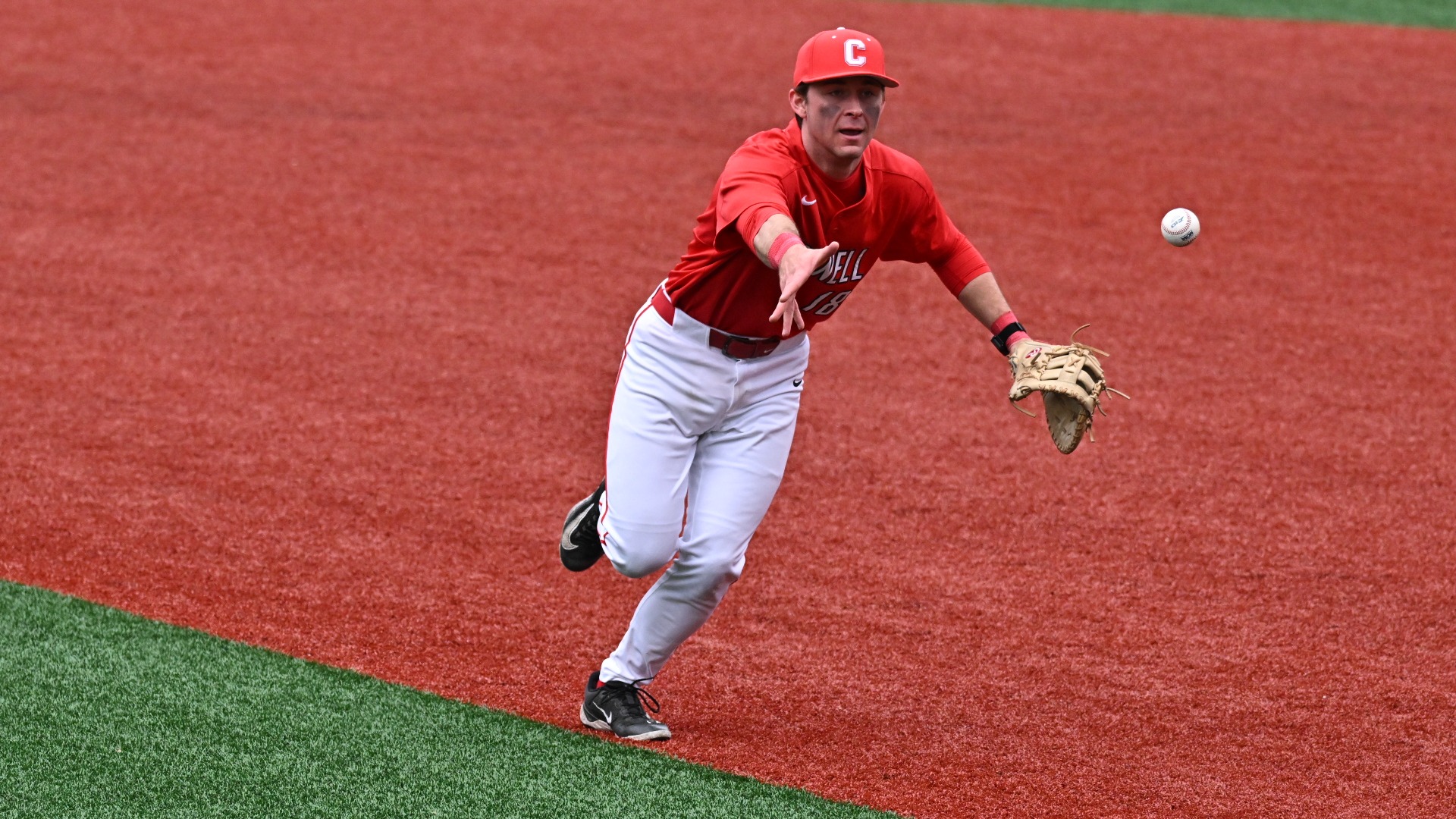 Cornell baseball senior first baseman TJ Swidorski tosses a baseball toward first base during game action against Richmond on Feb. 27, 2026, at Pitt Field in Richmond, Va.