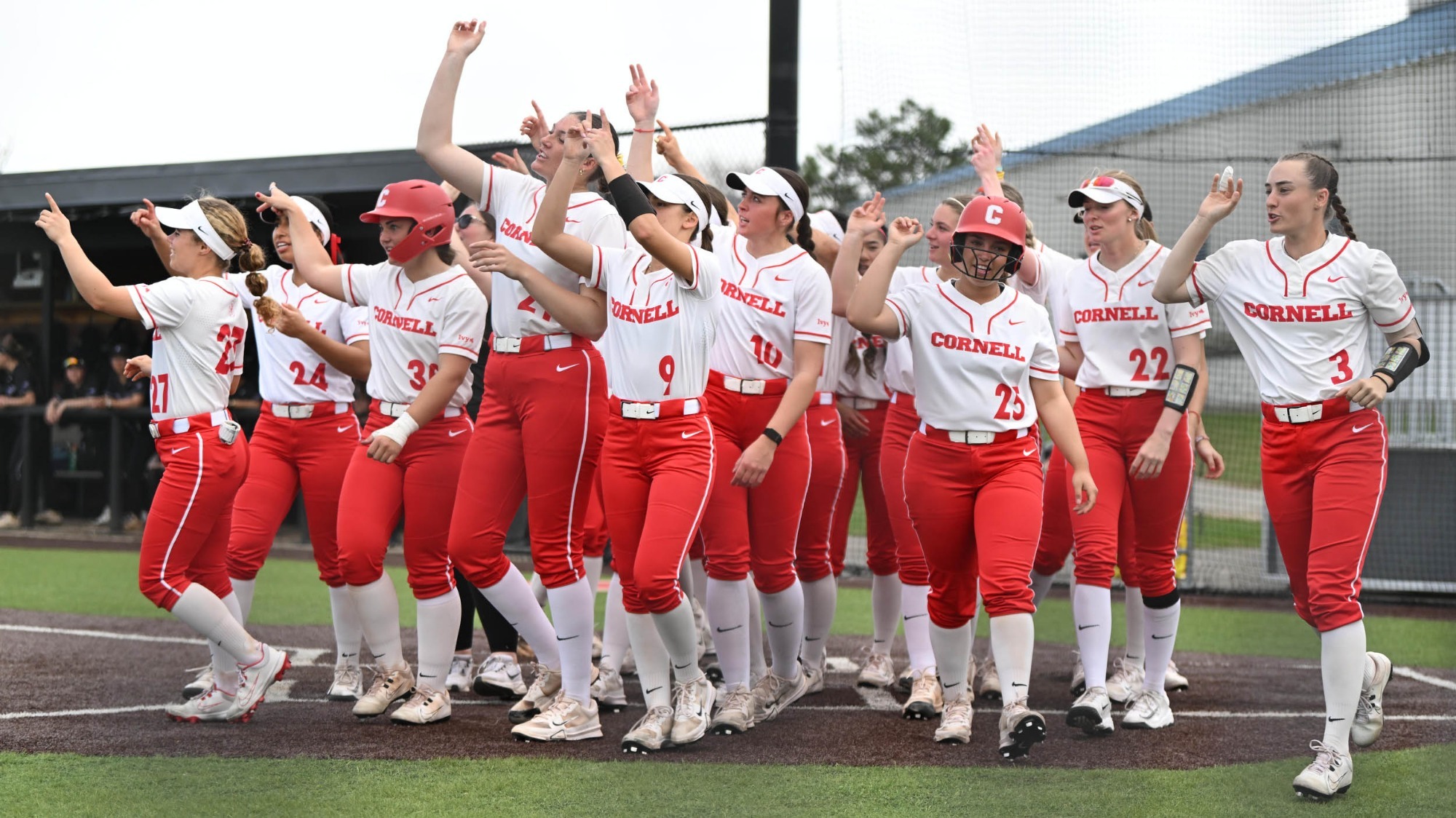 Cornell celebrates a home run at the plate at Niemand-Robison Field