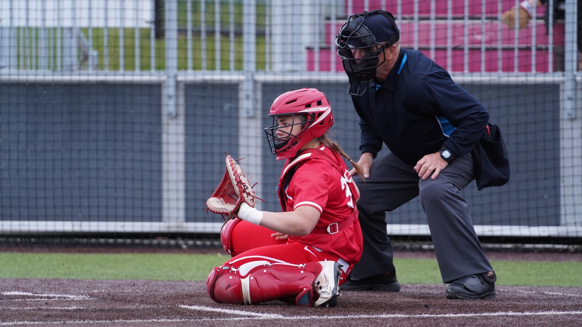 Lauren Holt at catcher in front of the umpire at Niemand-Robison Field.