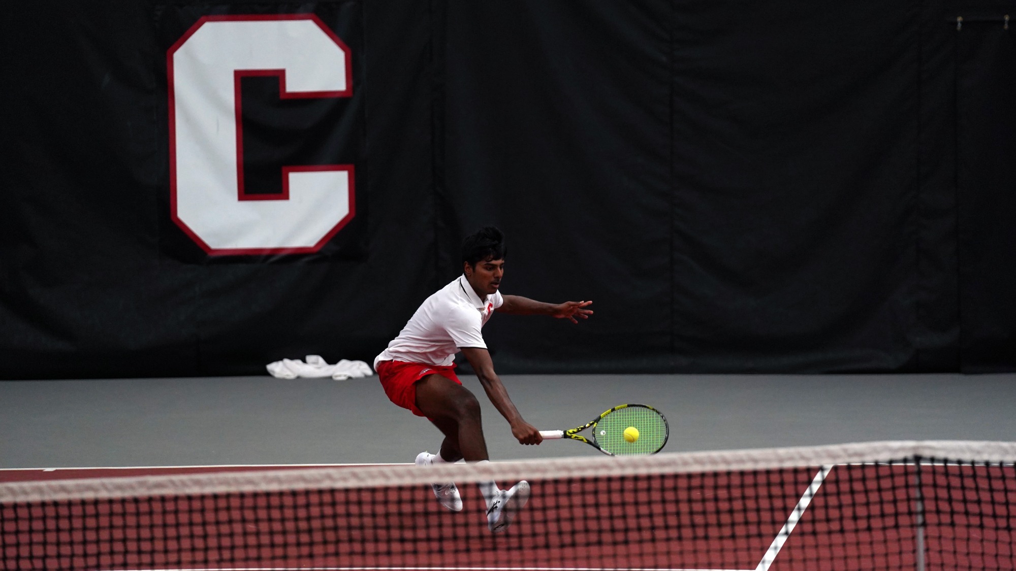 Rethin Pranav Senthil Kumar hits a drop shot during his straight-sets victory over Harvard on April 19, 2026 at the Reis Tennis Center in Ithaca, N.Y.