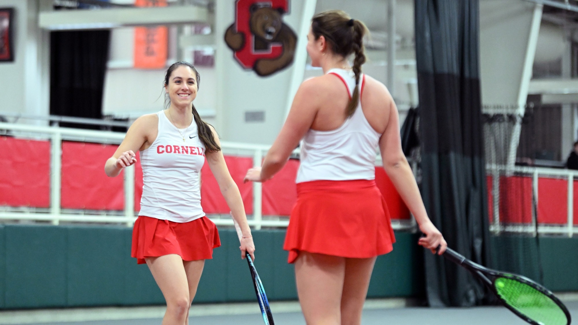 Michelle Ryndin (left) and Sage Loudon celebrate after winning a point in doubles. The duo were named to the 2026 All-Ivy first-team in doubles.