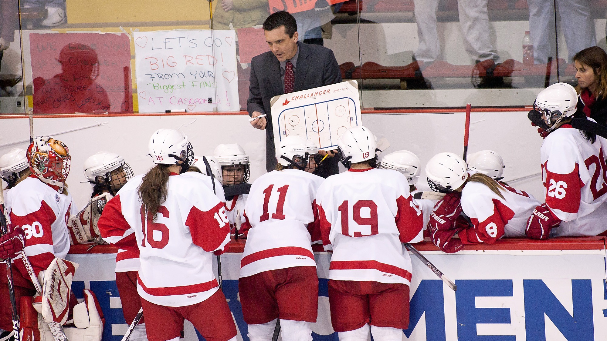 Head coach Doug Derraugh speaks with his team during a timeout in the Big Red women’s ice hockey team's triple-overtime 8-7 victory against Boston University in an NCAA Championship quarterfinal on March 14, 2012 at Lynah Rink in Ithaca, N.Y.