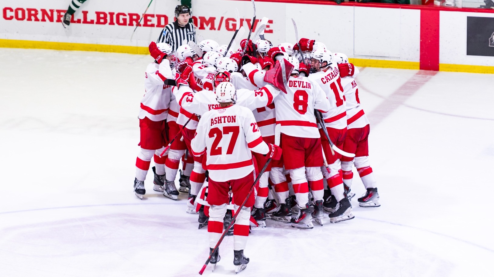 Members of the Cornell men's hockey team celebrate after defeating Dartmouth, 2-1, in overtime at Lynah Rink in Ithaca, N.Y., on Jan. 17, 2026.