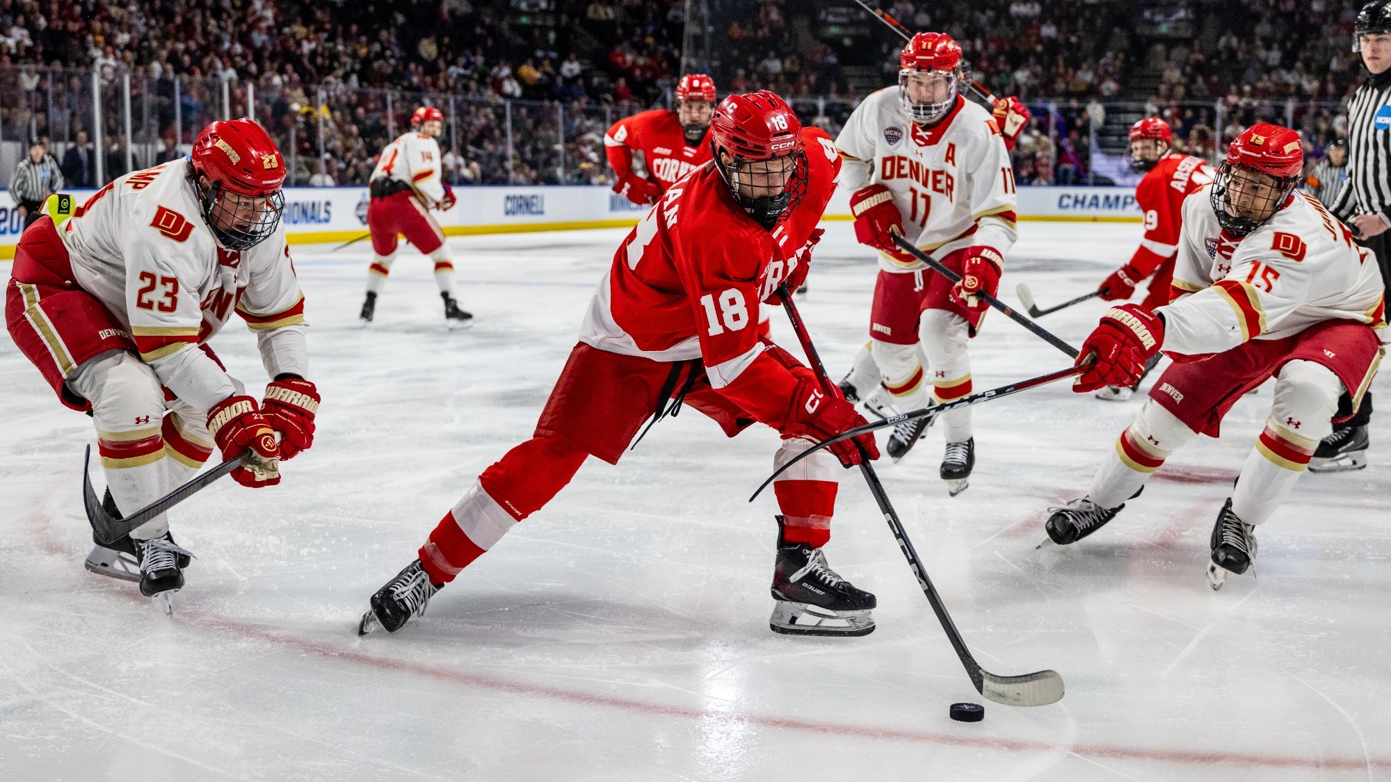Cornell men's hockey forward Gio DiGiulian carries the puck during game action against Denver inside Blue Arena in Loveland, Colo., on March 27, 2026.