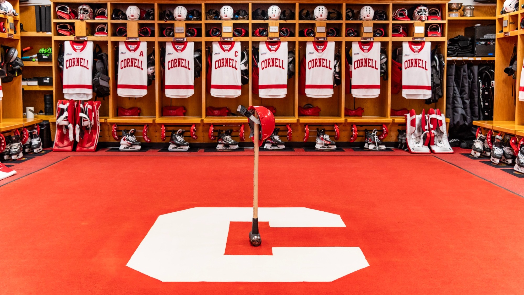 A wide shot of the Cornell men's hockey dressing room before the Big Red's first game in the quarterfinals of the 2026 ECAC Hockey Championship against Harvard on March 13, 2026, at Lynah Rink in Ithaca, N.Y.