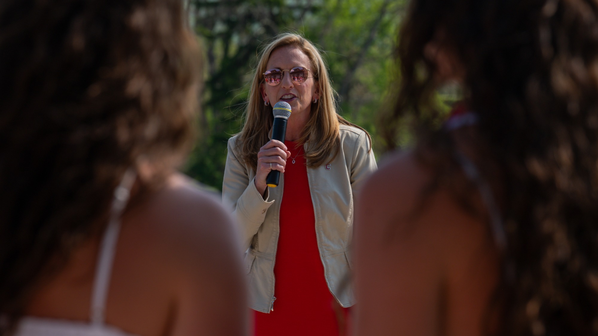 Dr. Nicki Moore addresses student-athletes at the 2026 Senior Toast in May 2026 on the Tanner Terrace in Ithaca, N.Y.