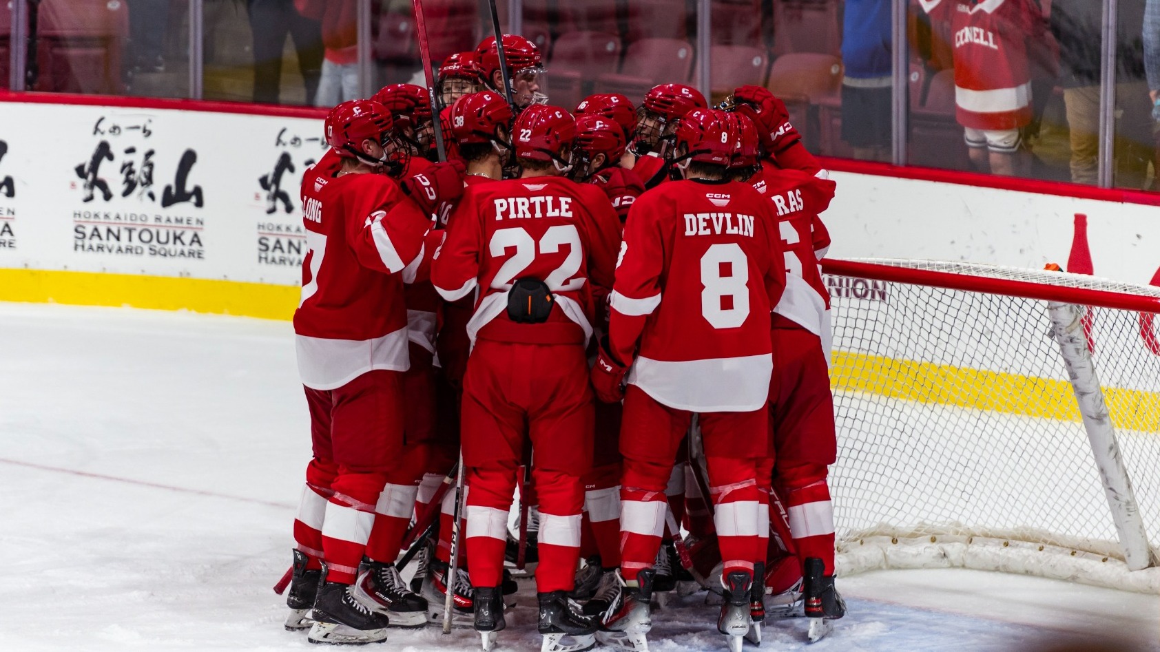 Members of the Cornell men's hockey team huddle during game action against Harvard on Nov. 7, 2025, at Bright-Landry Hockey Center in Cambridge, Mass.