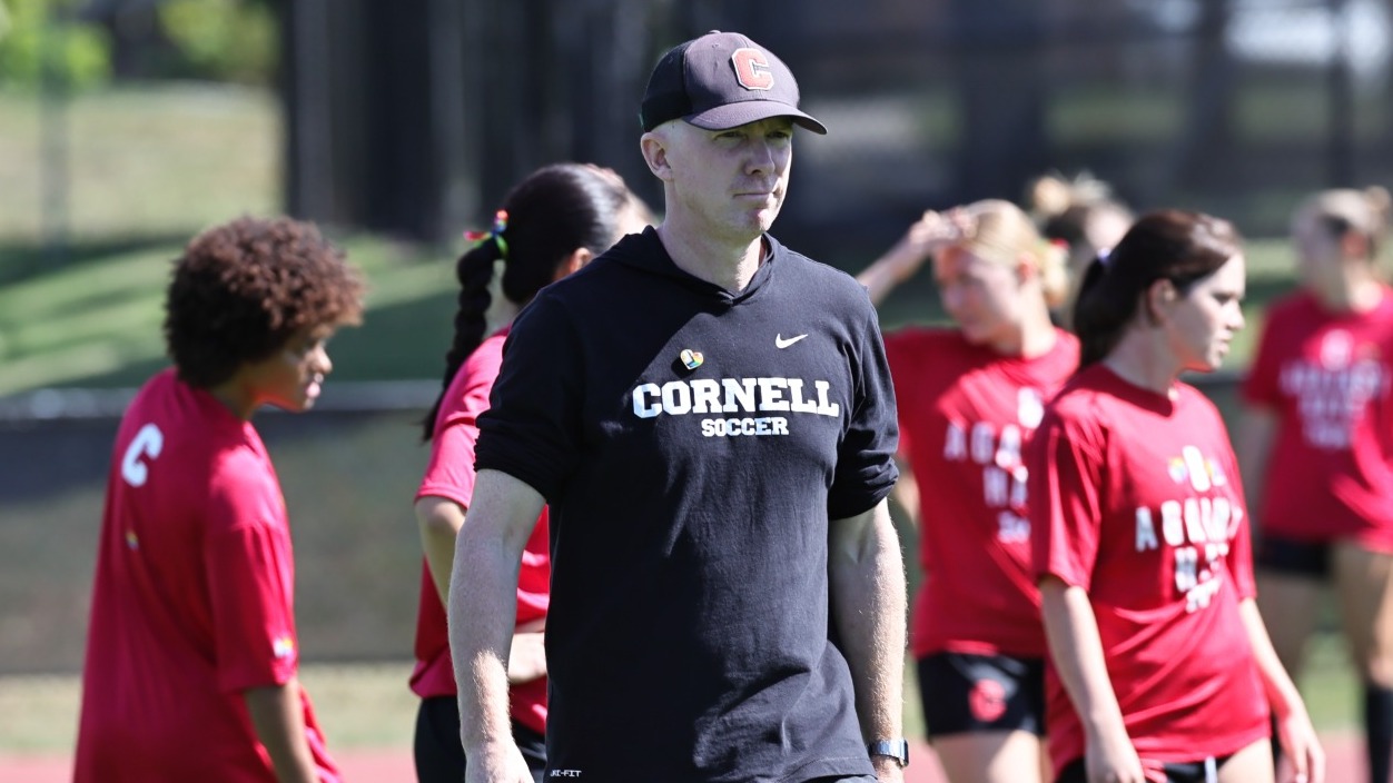 Cornell women's soccer head coach Rob Ferguson walks during warm-ups before a match against Columbia on Sept. 20, 2025, at Berman Field in Ithaca, N.Y.