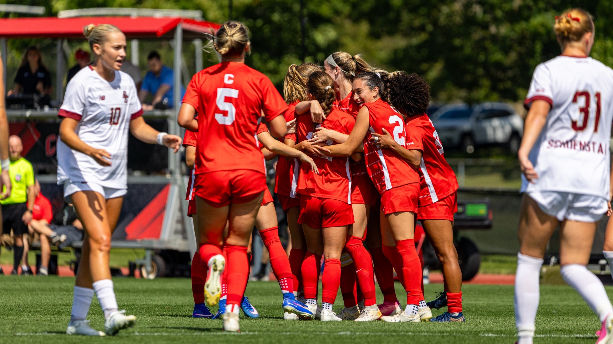 Members of the Cornell women's soccer team celebrate after senior midfielder Emily Gibbons' first-half goal against Boston College on Aug. 23, 2026, at Berman Field in Ithaca, N.Y.