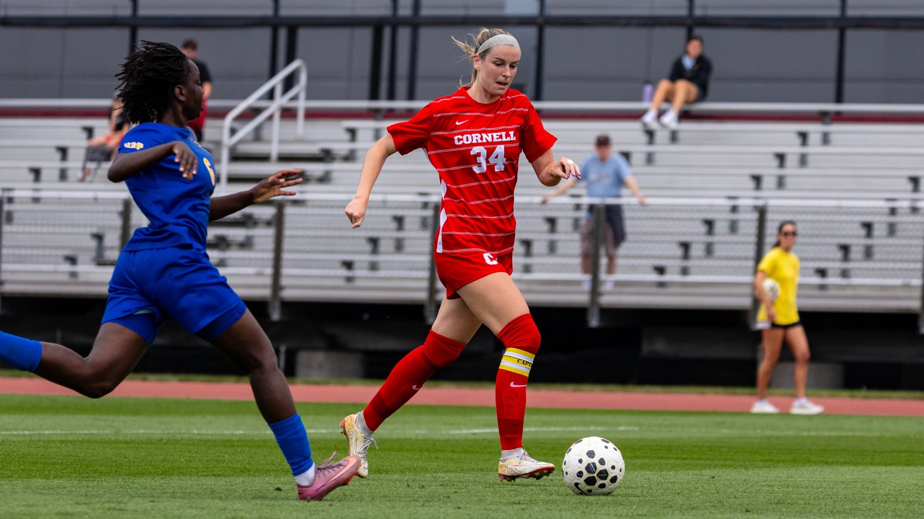 Cornell women's soccer senior midfielder and co-captain Emily Gibbons dribbles past a Pittsburgh defender at Berman Field in Ithaca, N.Y., on Aug. 30, 2026.