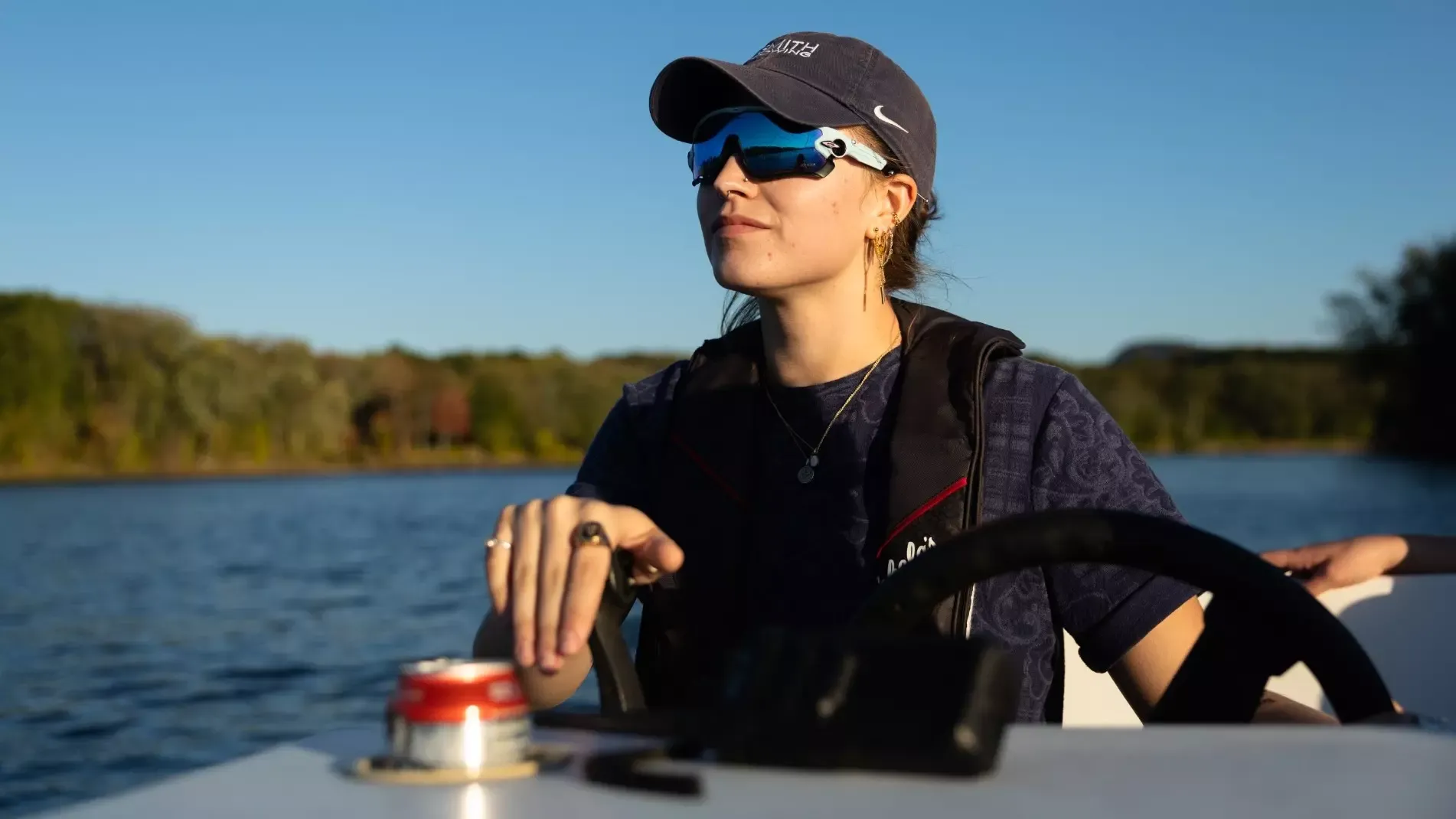 New Cornell women's rowing coach Hannah Ondak steers a boat during practice while at Smith College.